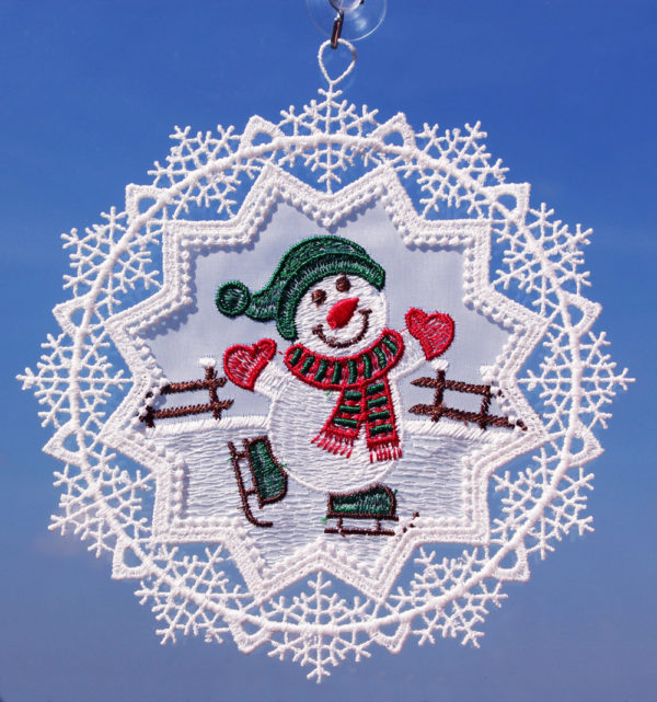 Schneestern mit Schneemann