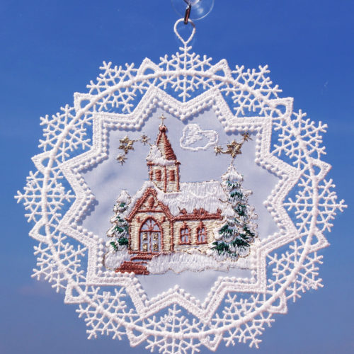 Schneestern mit Kirche